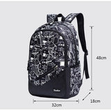 Sac à dos garçon cm2 noir avec motifs blanc dessinés